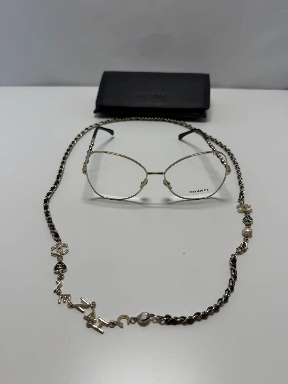 CHANEL  Gold and Black Eye ear Chain with Silver-Tone Glasses